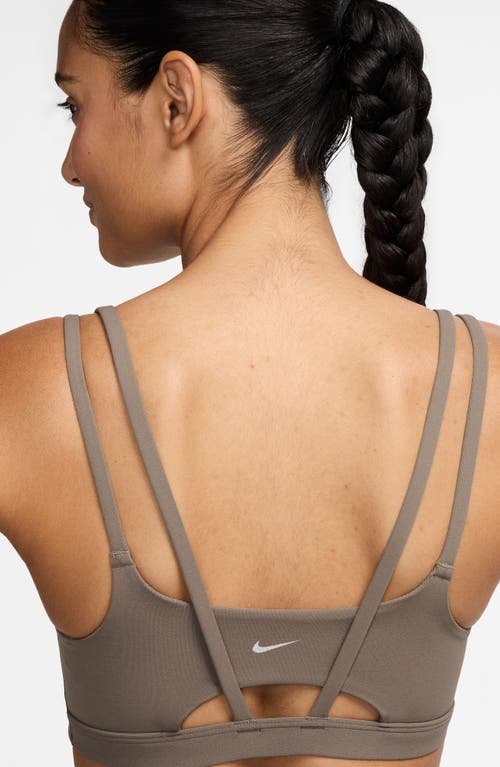 Shop Nike Zenvy Strappy Light-support Padded Sports Bra In Mink Brown/white