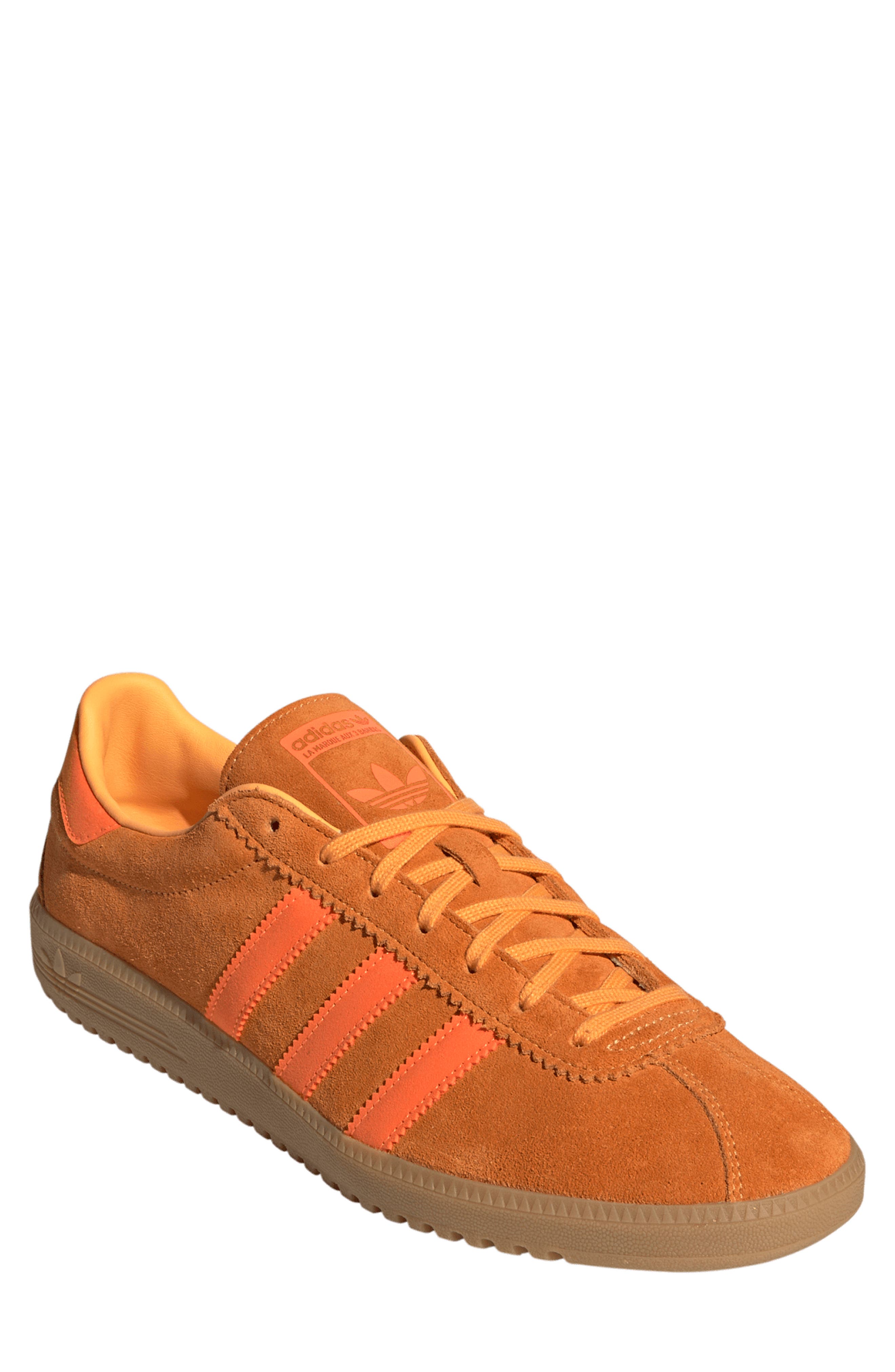 orange addidas trainers
