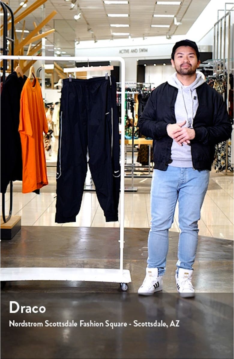 Solo Swoosh Water Repellent Track Pants, sales video thumbnail