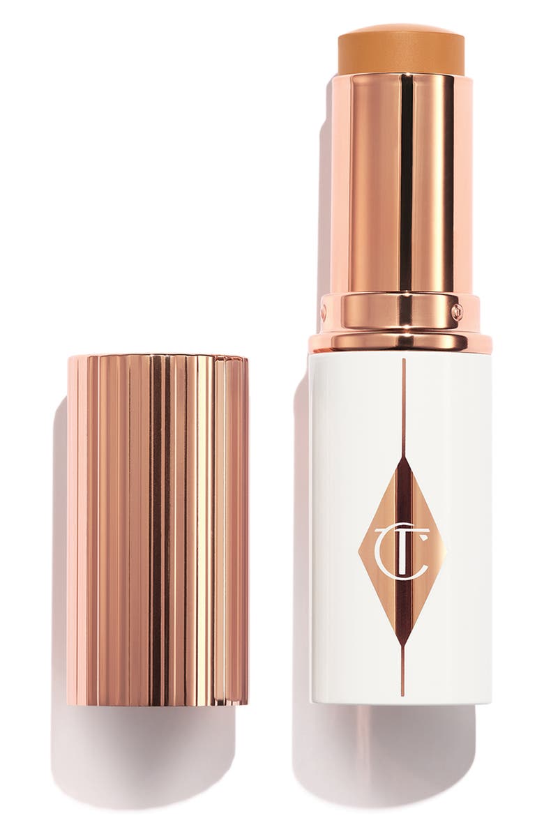 Charlotte Tilbury Unreal Skin Sheer Glow Tint Hydrating Foundation Stick, Main, color, 10 Tan