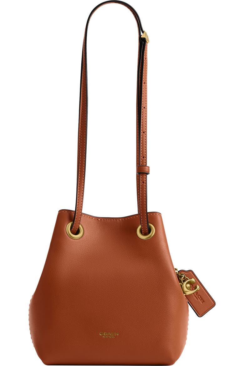 coach bucket backpack 90s black top handle - 9992 It includes an inside snap pocket and a removable zip pouch to keep small essentials organized COACH Jade Drawstring Bucket Bag