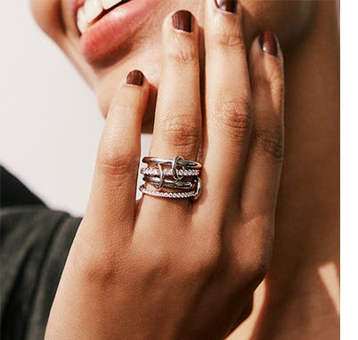 Woman wearing Spinelli Kilcollin stack ring.