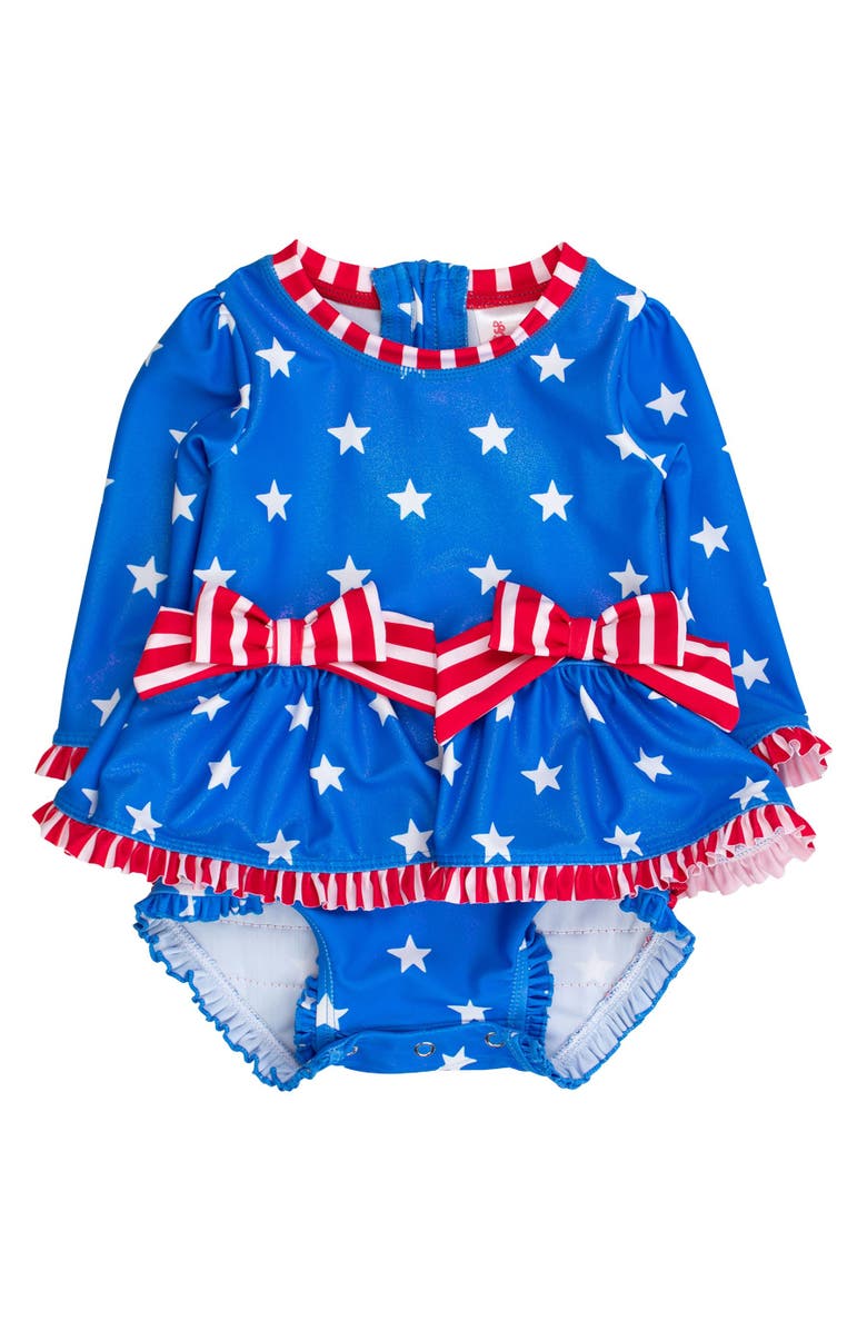 RuffleButts UPF50+ Long Sleeve One Piece Bow Peplum Rash Guard Swimsuit, Main, color, Shimmer Stars & Stripes