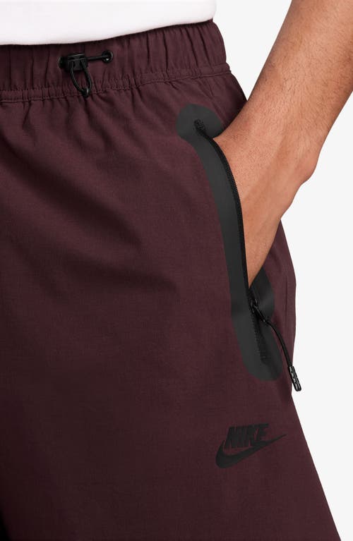 Nike Dri-fit Tech Wide Leg Woven Pants In Burgundy