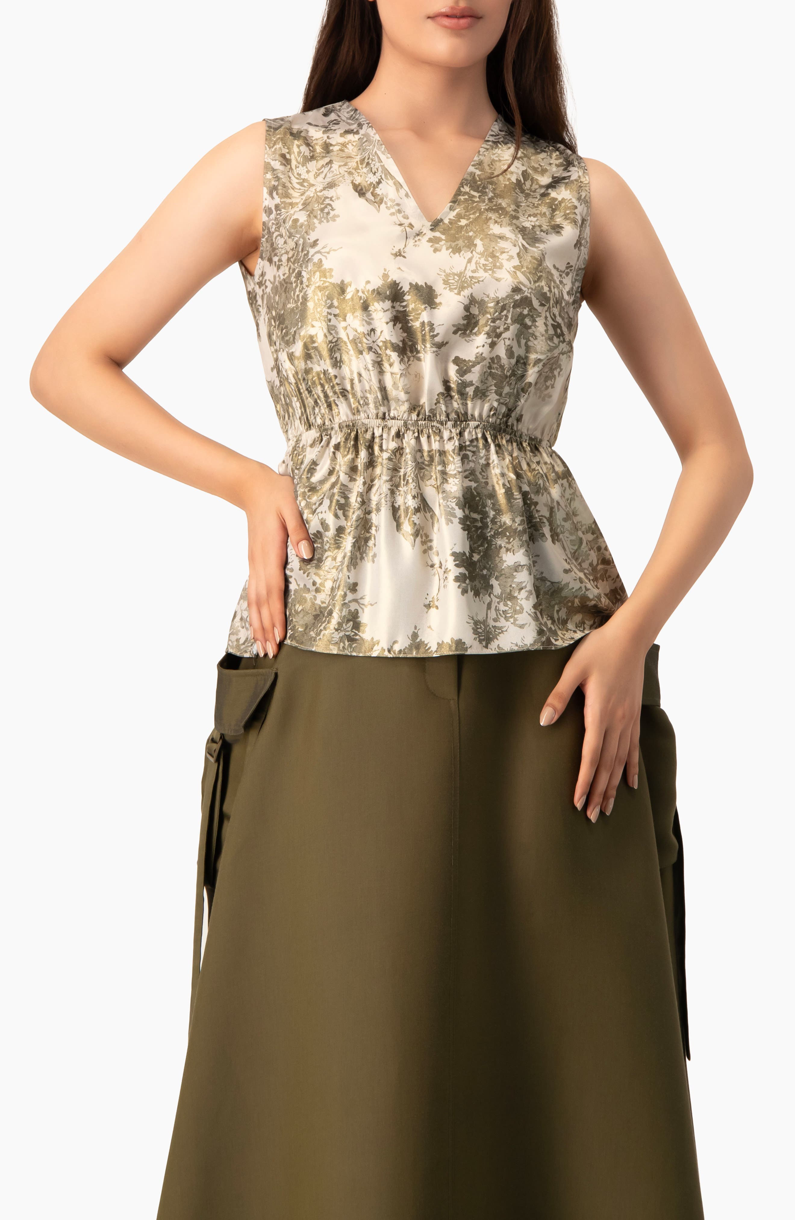 Ivonne Sleeveless Peplum Blouse In Green
