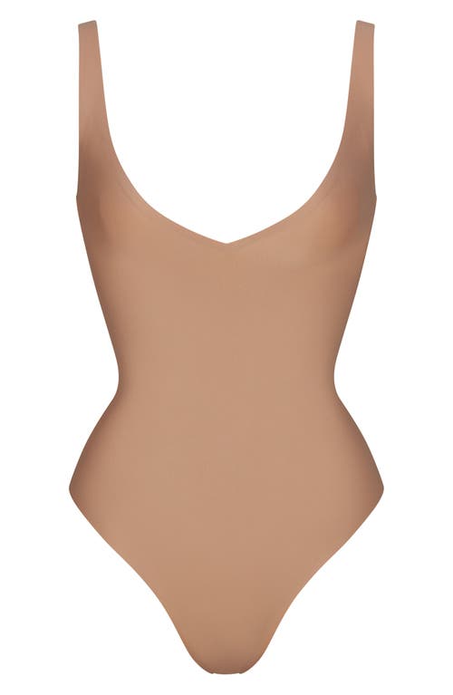 Skims Unlined Plunge Thong Bodysuit In Brown