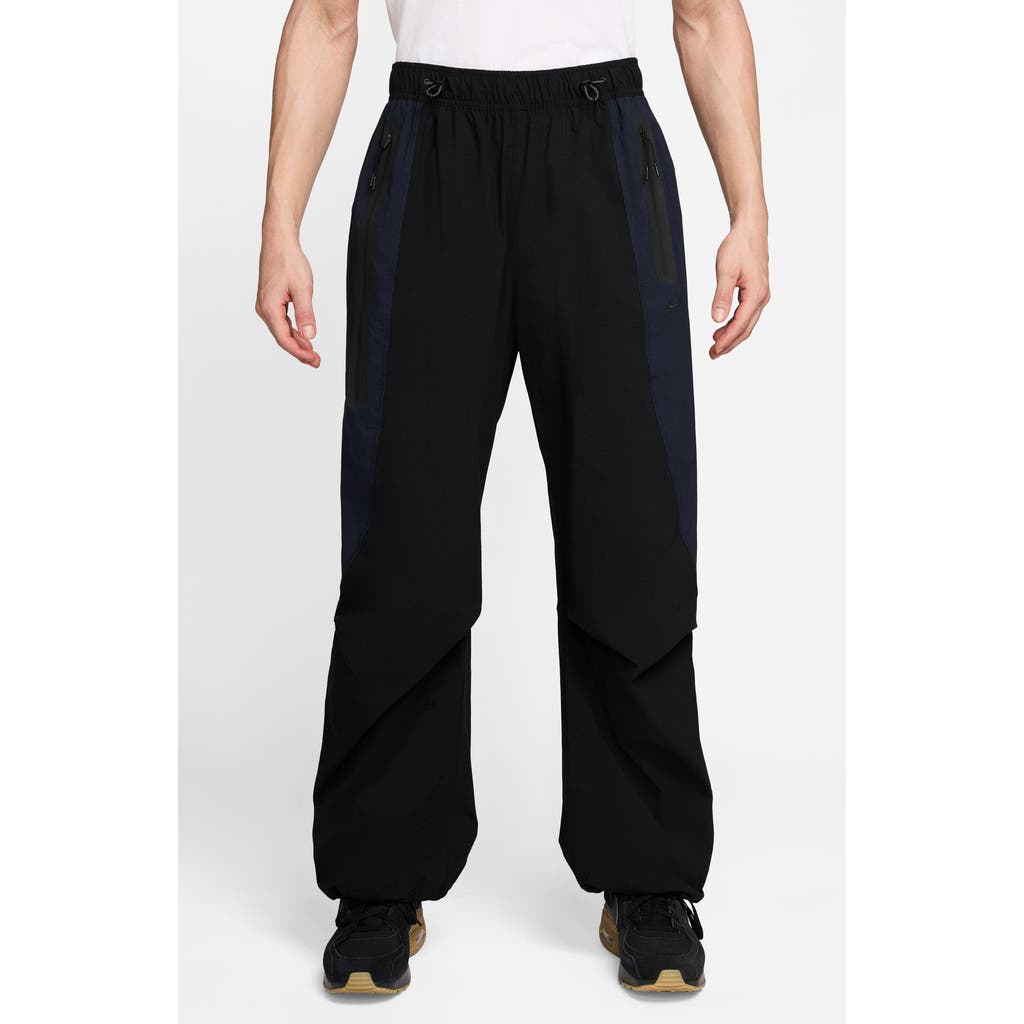 Nike Tech Dri-fit Woven Oversize Stretch Nylon Pants In Black