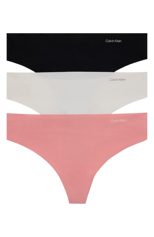 Shop Calvin Klein Invisibles 3-pack Thongs In Wak Shark/wind
