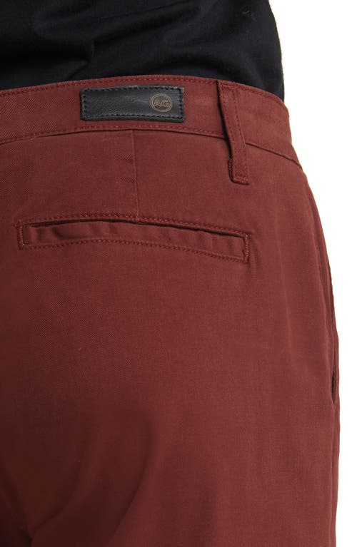Ag The Caden Straight Leg Pants In Dark Sangria