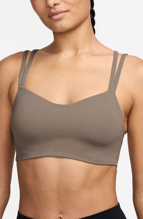 Shop Nike Zenvy Strappy Light-support Padded Sports Bra In Mink Brown/white