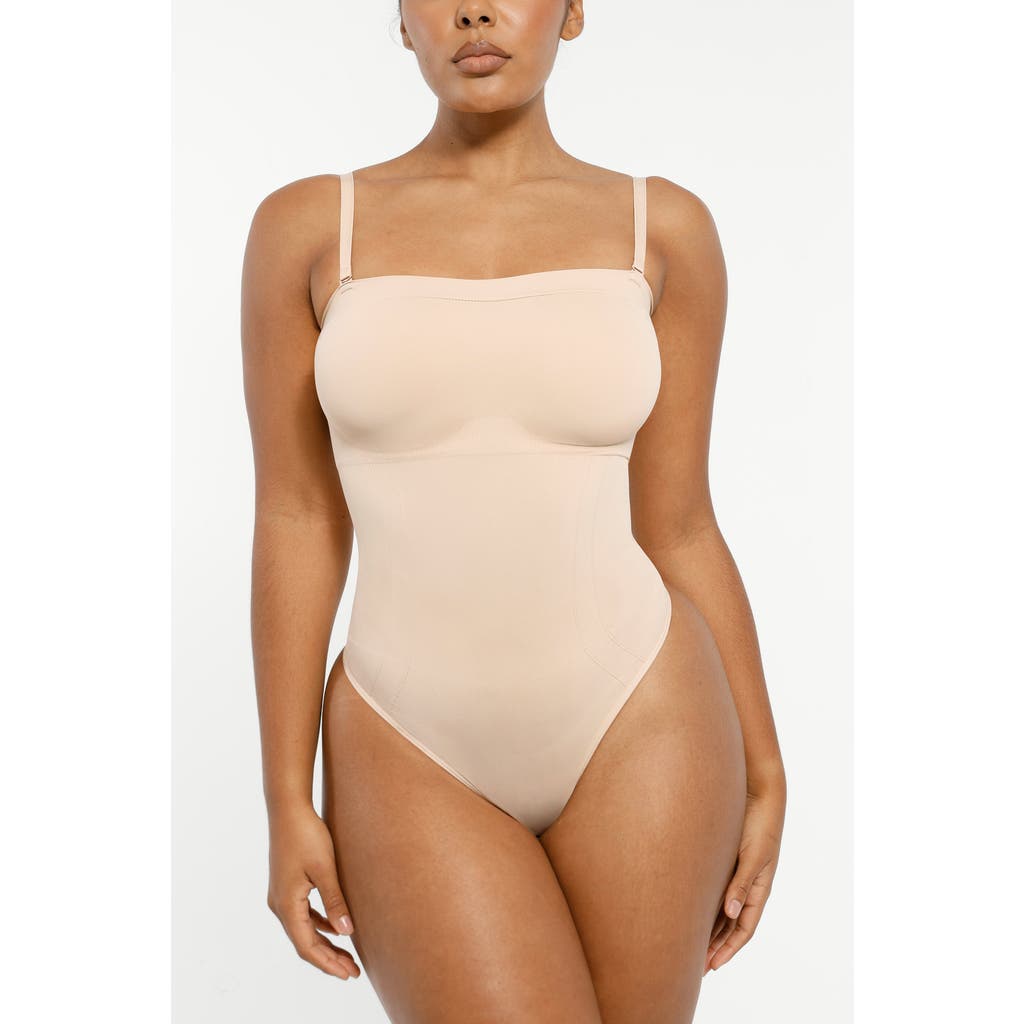 Shapellx Skin Flow Strapless Sculpt Thong Bodysuit In Neutral