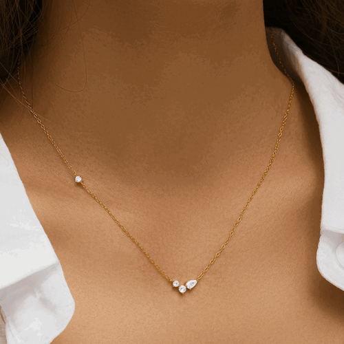 Hollywood Sensation Orlina Delicate Necklace With Three Round And One Pear Cut Cubic Zirconia Stones In Gold