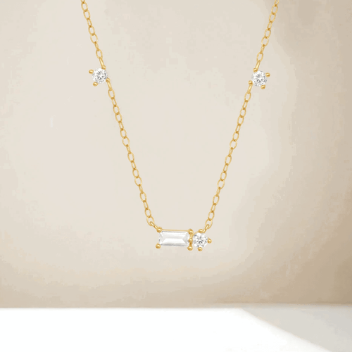 Hollywood Sensation Starluxe Delicate Necklace With Three Round Cut And One Emerald Cut Cubic Zircon In Gold