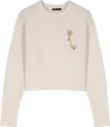 maje Sweater with floral brooch