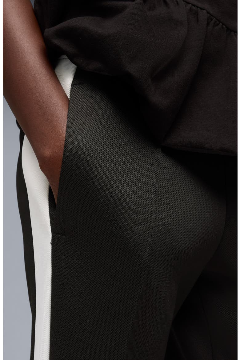 T7 Relaxed Flare Track Pants, Alternate, color, PUMA BLACK