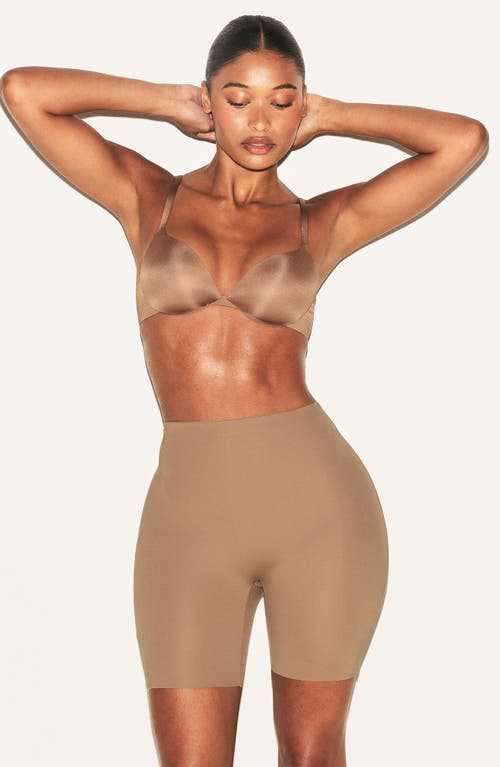 Skims Hip Enhancing Mid Thigh Padded Shorts In Brown