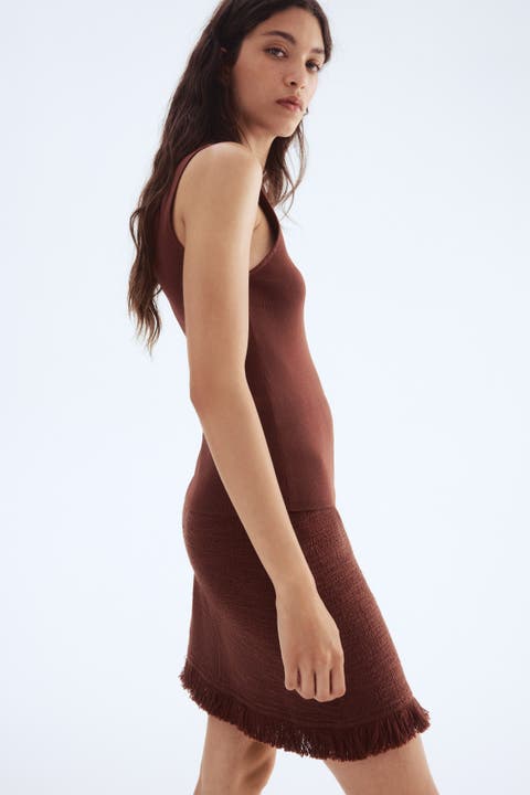 Bouclé skirt with fringe