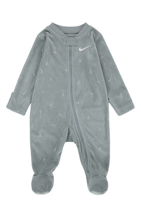 Essentials Swoosh Print Velour Footie<br /><br /><br /><br /><br /><br /><br /><br /><br /><br /><br /><br /><br /><br /><br /><br /><br /><br /><br /><br /><br /><br /><br /><br />Essentials Fleece Footie (Baby)
