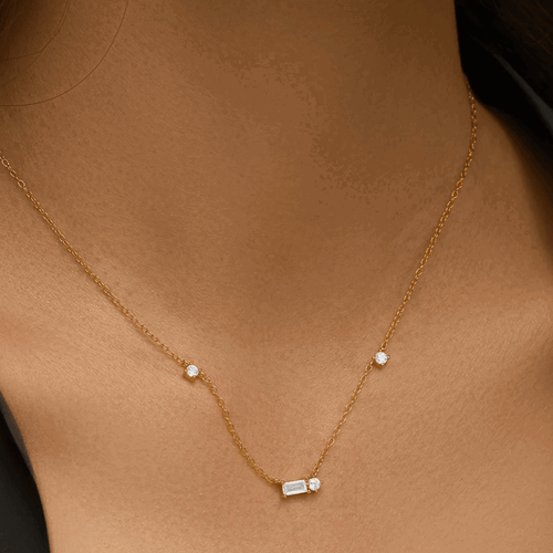 Hollywood Sensation Starluxe Delicate Necklace With Three Round Cut And One Emerald Cut Cubic Zircon In Gold