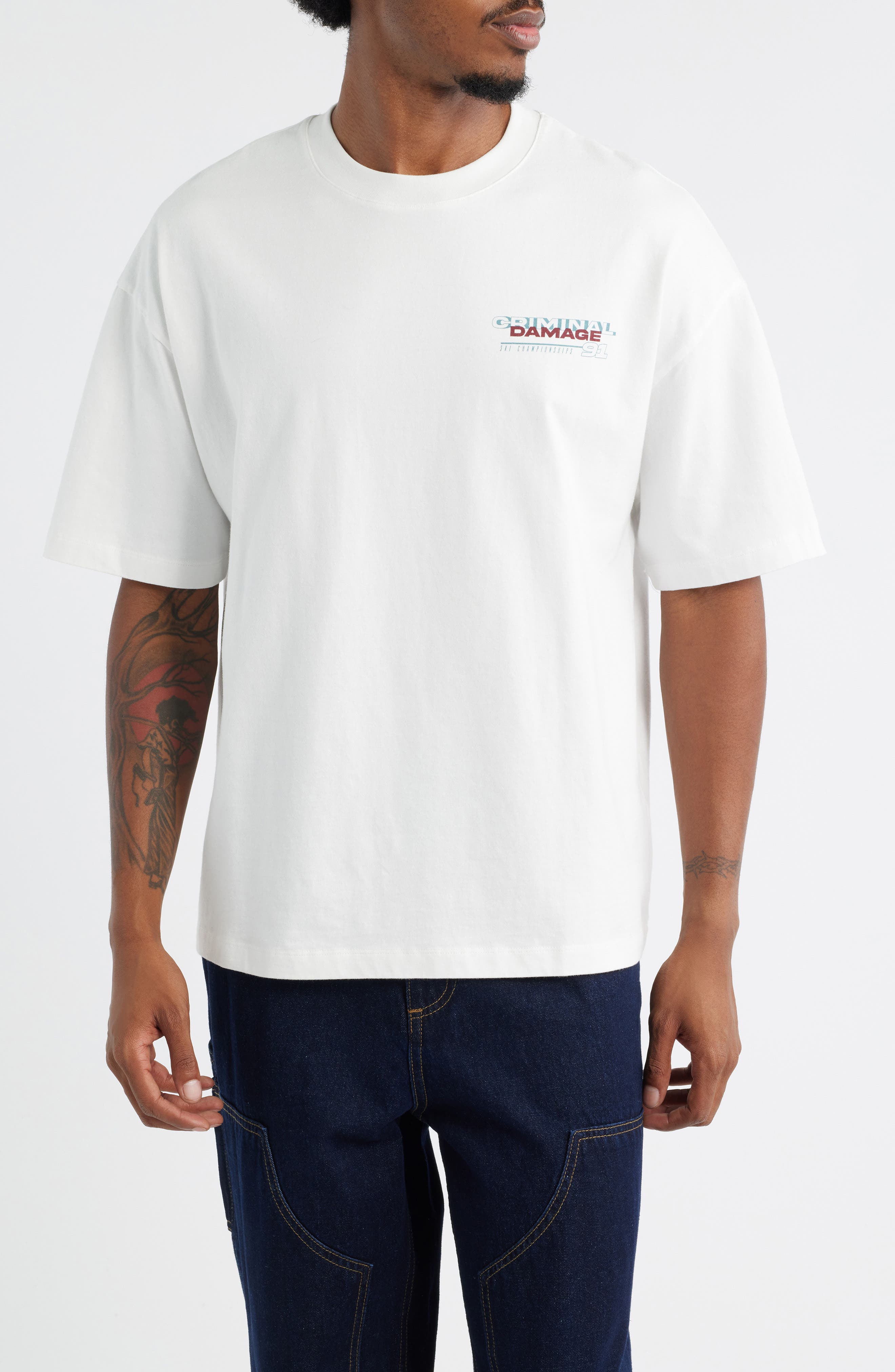CRIMINAL DAMAGE Aprés Ski Oversize Graphic T-Shirt in Off White 