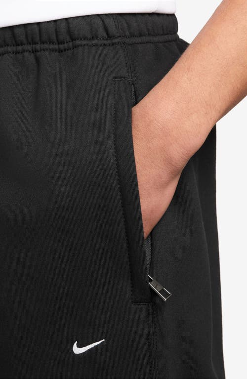 Nike Solo Swoosh Open Hem Fleece Sweatpants In Black