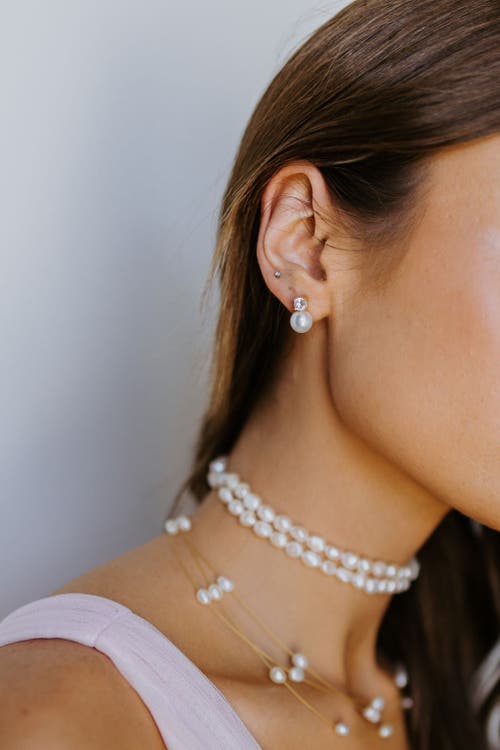 Untamed Petals Maven Pearl And Crystal Studs In Gold