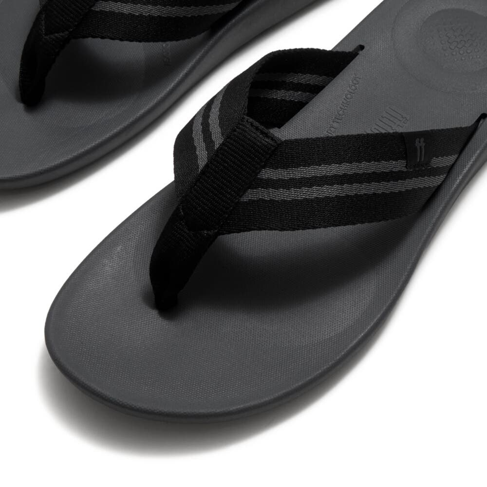 FitFlop Iqushion Mens Two-Stripe Webbing Flip-Flops, Alternate, color, Black/Charcoal
