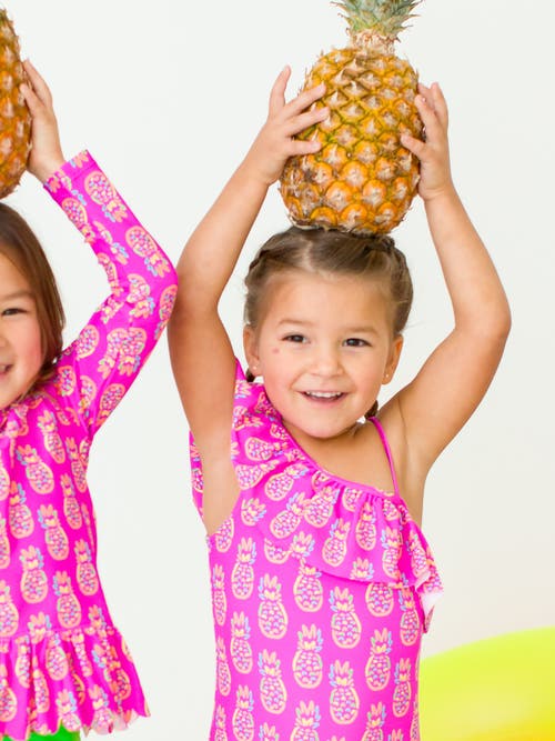 Shop Rufflebutts Girls Upf50+ Sun Protection One Shoulder Ruffle One Piece In Neon Violet Pineapples