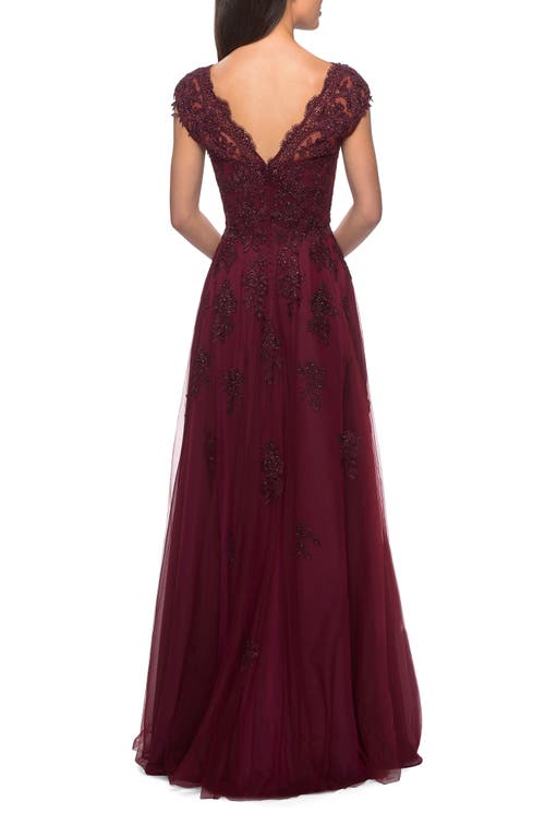 LA FEMME LA FEMME SHORT SLEEVE LACE GOWN WITH CASCADING EMBELLISHMENTS