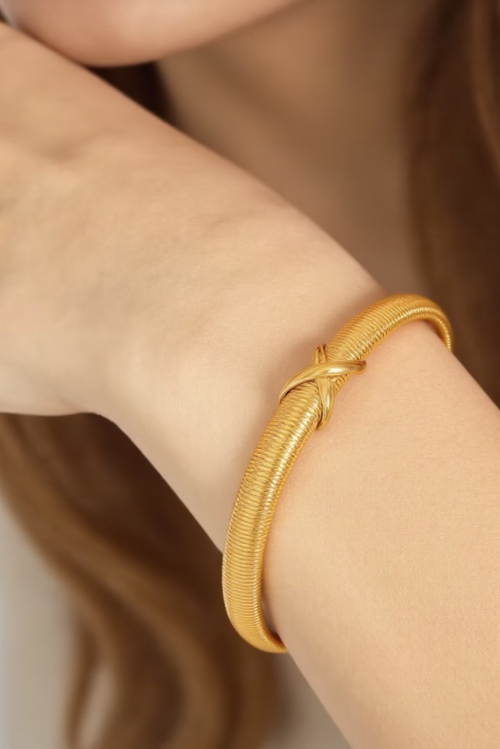 Akalia Stylish Waterproof Love Twist Bracelet With Gold Plating In Gold