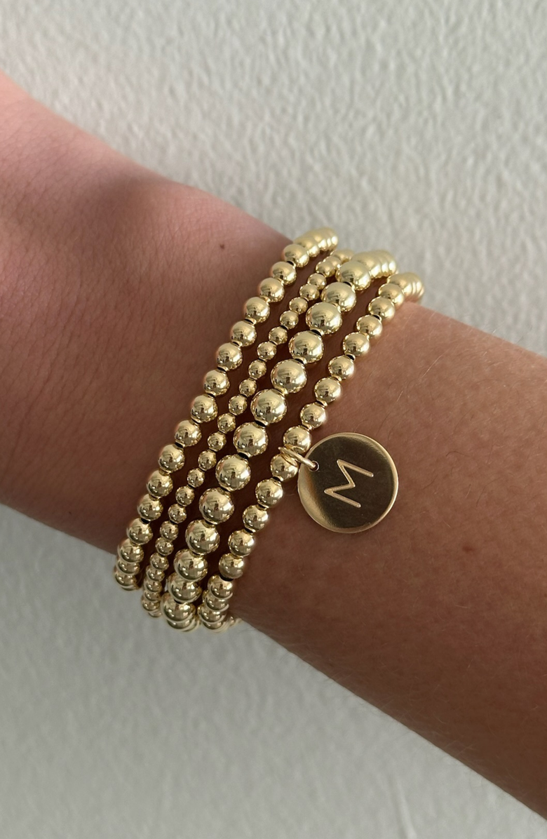CUFFED BY NANO Classic Initial Coin 14k Gold Filled Bead Four Bracelet Stack, Alternate, color, Gold F