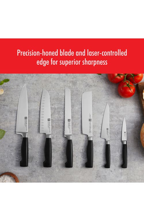 Zwilling Four Star 7-inch Hollow Edge Santoku Knife