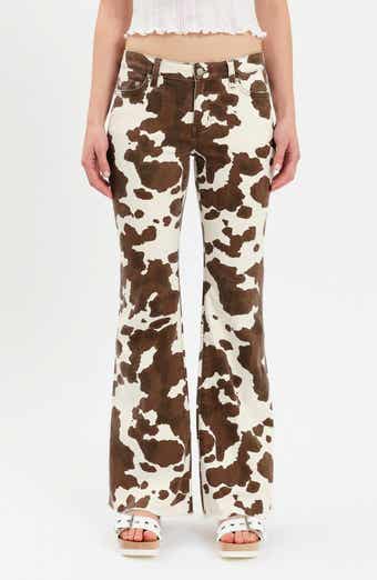 Lowkey Cow Print Flare Jeans
