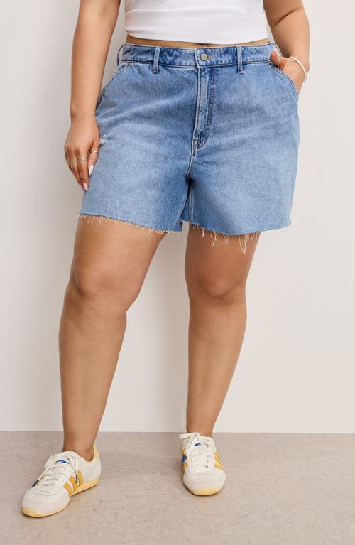 Shop Good American Cutoff Carpenter Denim Shorts In Indigo