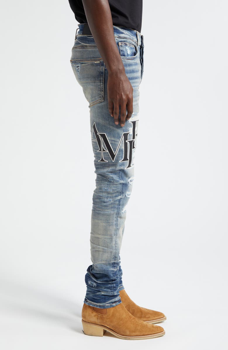 AMIRI Staggered Logo Distressed Skinny Jeans, Alternate, color,