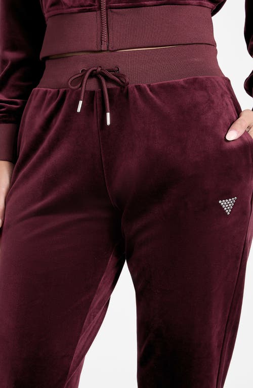 Guess Velvet Joggers In Burgundy