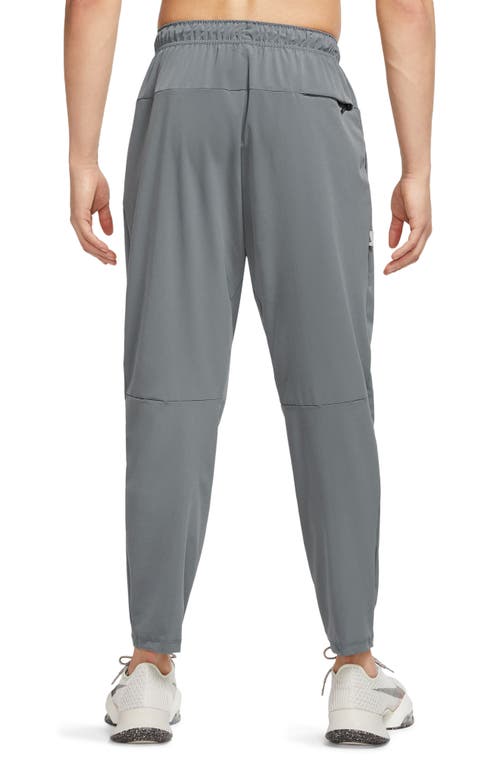 Nike Dri-fit Unlimited Drawstring Pants In Gray