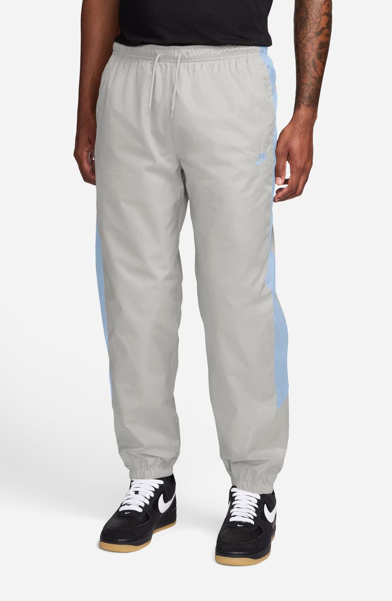 Nike Windrunner Water Repellent Track Pants, Main, color, Vast Grey/ Hydrogen Blue