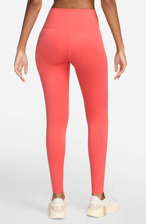 Shop Nike Universa Medium-support High-waisted Pocket 7/8 Leggings In Magic Ember/black