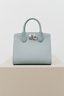 A blue designer handbag. 