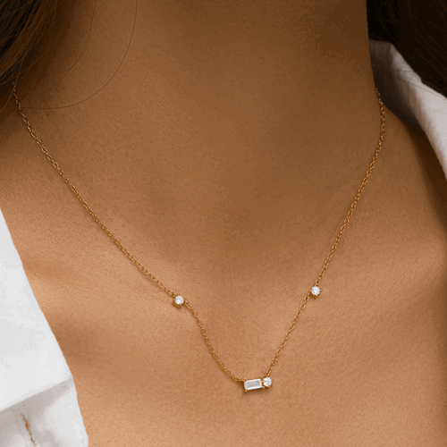 Hollywood Sensation Starluxe Delicate Necklace With Three Round Cut And One Emerald Cut Cubic Zircon In Gold