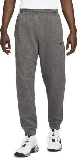 Nike therma men's tapered training trousers best sale