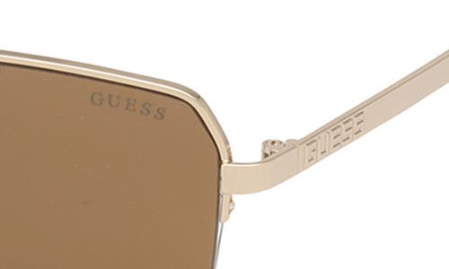 Shop Guess 59mm Navigator Sunglasses In Gold/brown