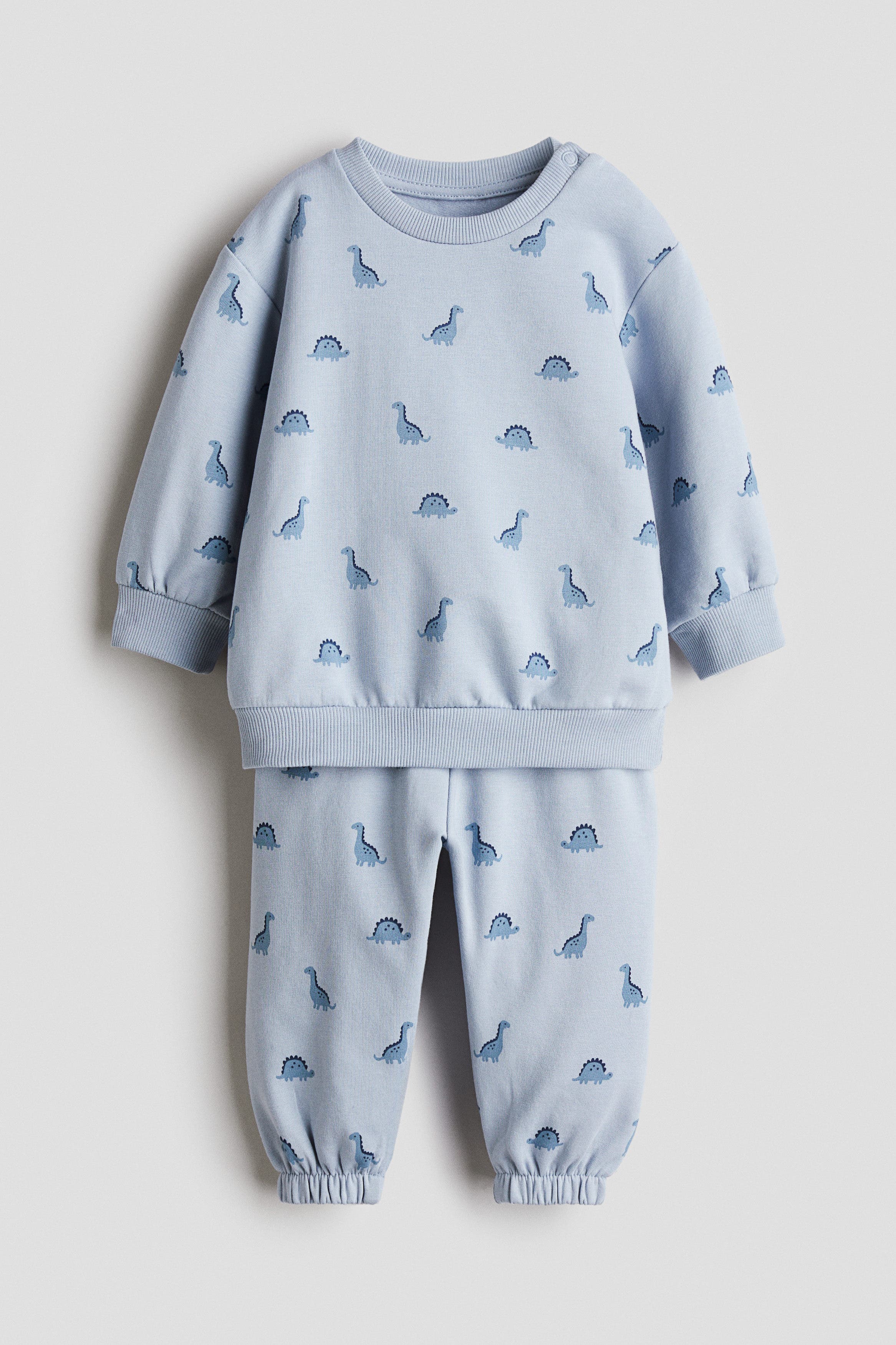 Light blue/dinosaurs