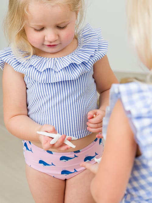 Shop Rufflebutts Baby/toddler Girls Upf50+ Sun Protected Ruffle Tankini In Pink Whale Friends