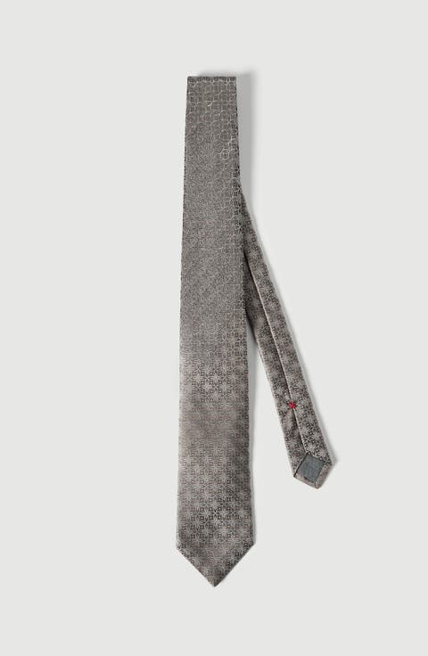 Silk tie with geometric floral pattern