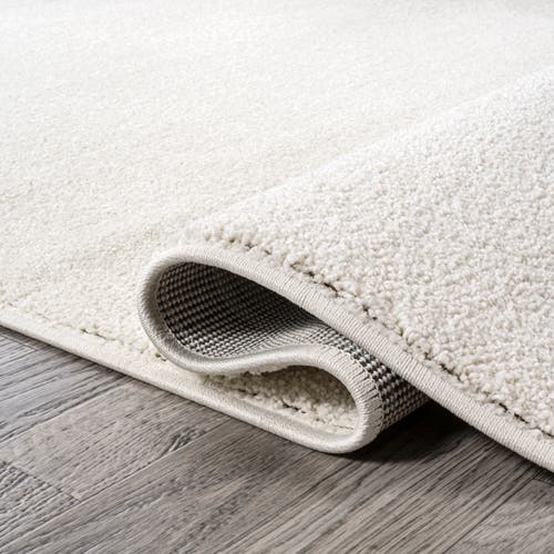 Shop Jonathan Y Haze Solid Low-pile Area Rug In Beige/ecru