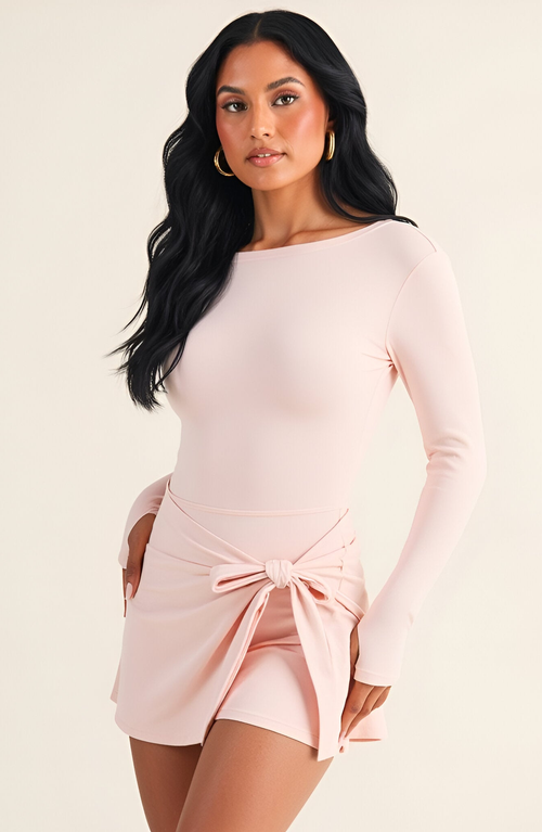 Modenaire Sleeveless Active Romper With Side Tie Skirt Overlay And Scoop Neckline In Pink