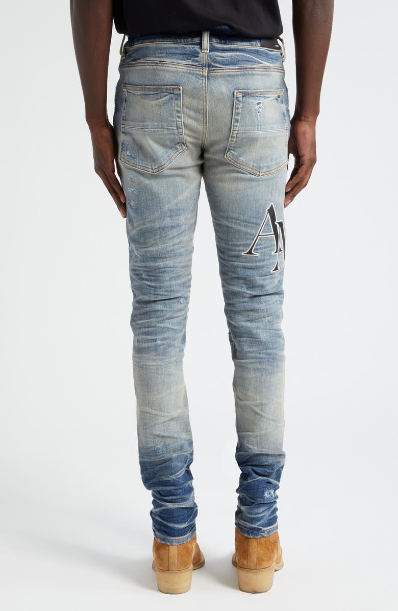 AMIRI Staggered Logo Distressed Skinny Jeans, Alternate, color,