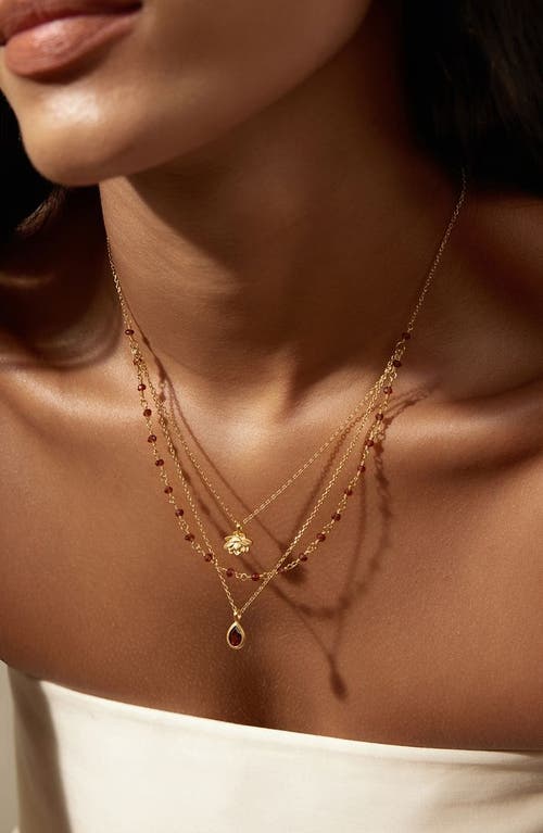 Satya Jewelry Embrace Change Garnet Lotus Triple Necklace In Brown